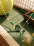 Close-up of natural jadeite tennis racket pendant and jade bead